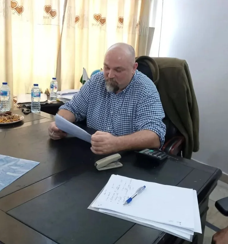 Mr. Clark reviewing a candidate CV